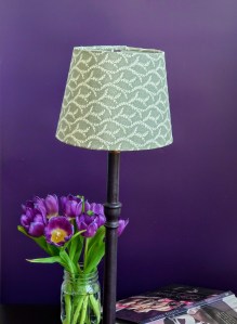 Green lampshade with feathery vine pattern