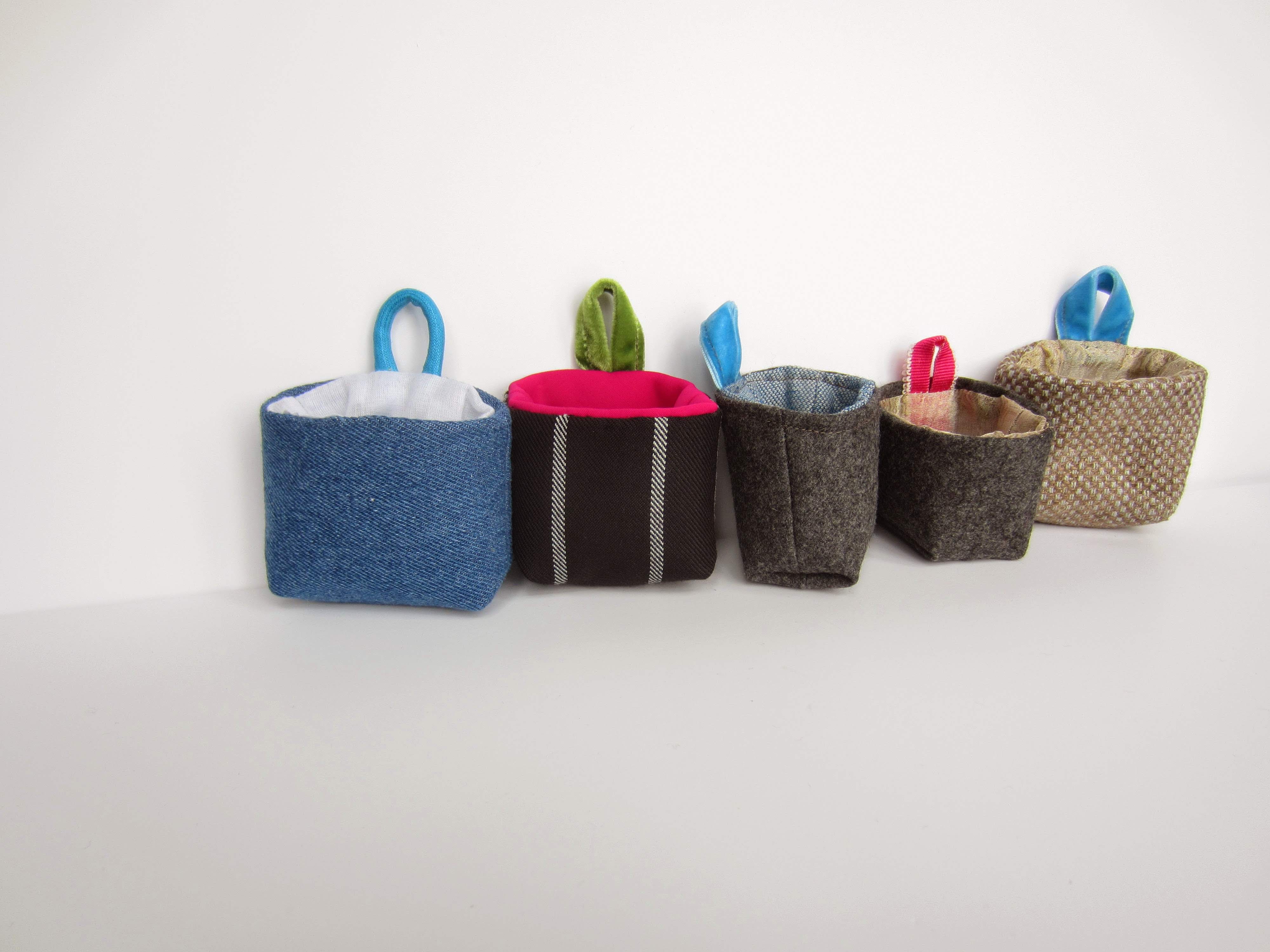 Small fabric baskets of various colours