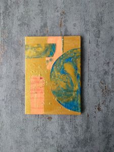Gold and orange mixed media painting on a thick grey concrete texture border. Painting has blue marbled skin elements 